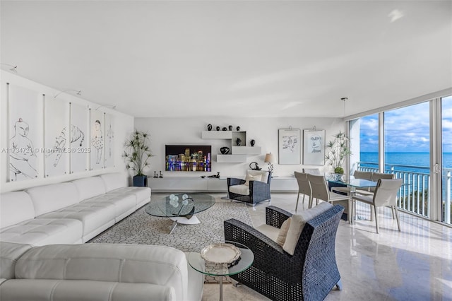 living room with expansive windows and a water view