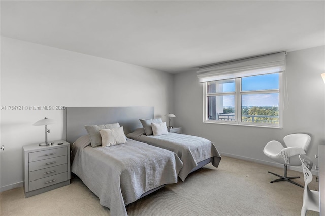 bedroom with light colored carpet