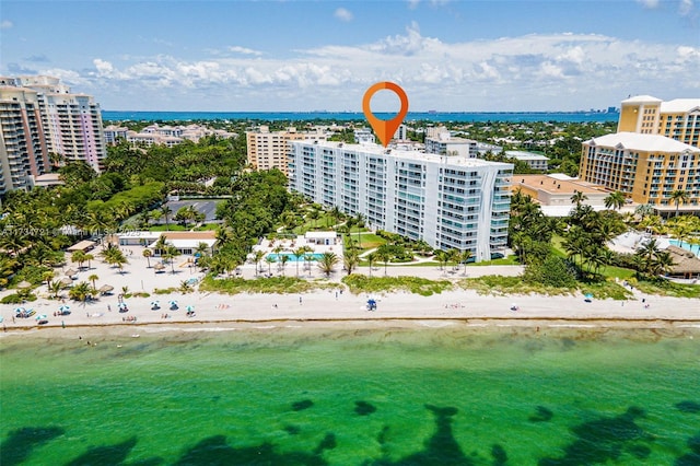 aerial view featuring a water view and a beach view