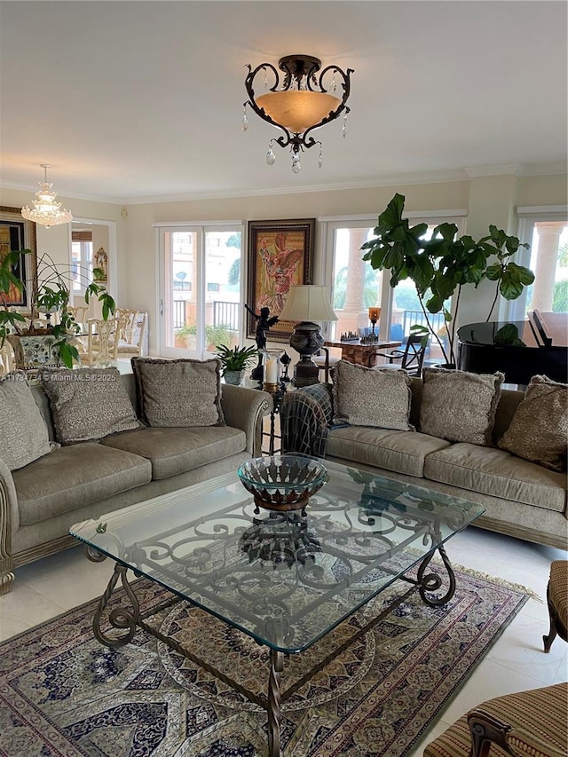 tiled living room featuring crown molding and a chandelier