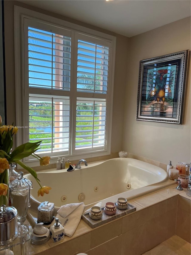 bathroom featuring tiled tub