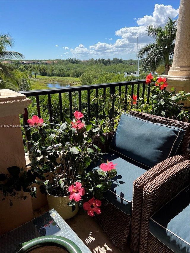 balcony featuring a water view