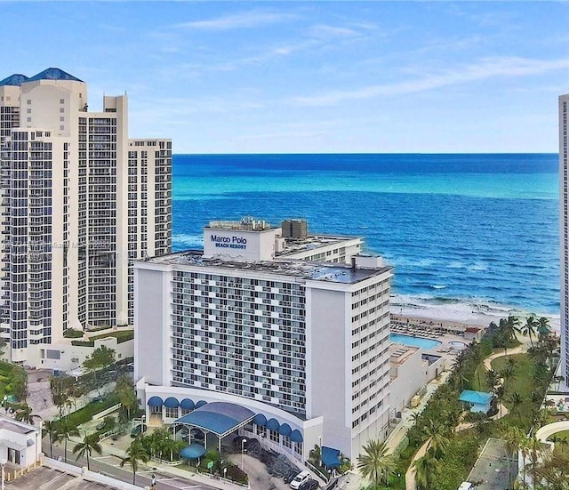 birds eye view of property with a view of the beach and a water view