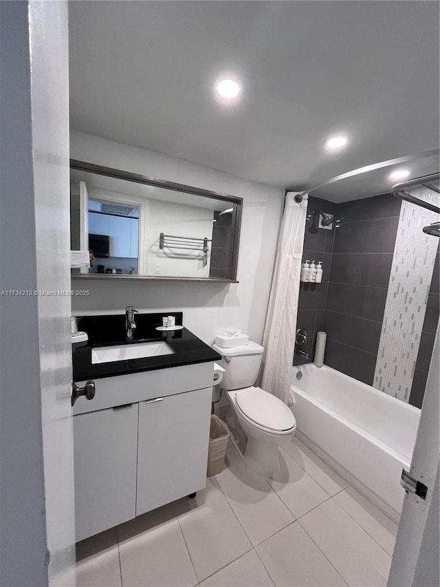 full bathroom with toilet, vanity, shower / bathtub combination with curtain, and tile patterned flooring