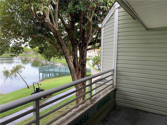 balcony featuring a water view