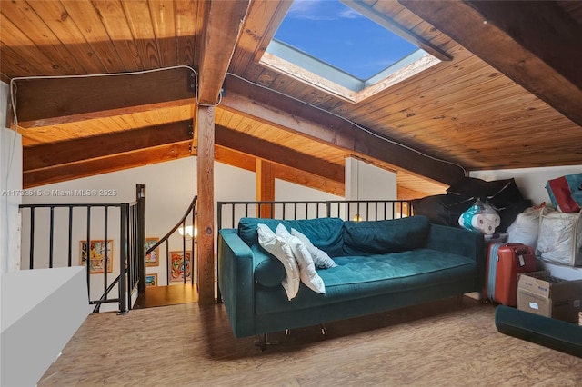 interior space featuring lofted ceiling with skylight and wood ceiling