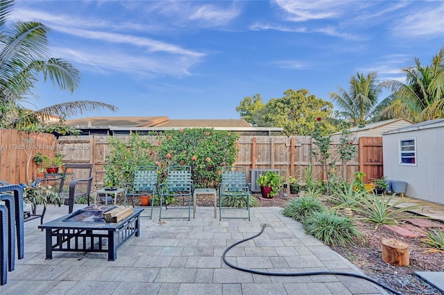 view of patio with a fire pit