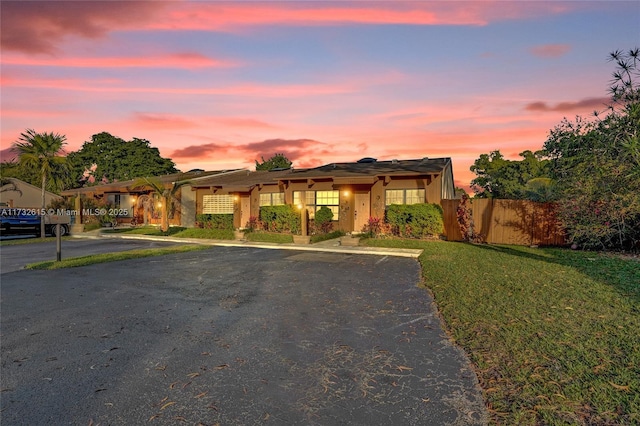 view of front of property with a yard