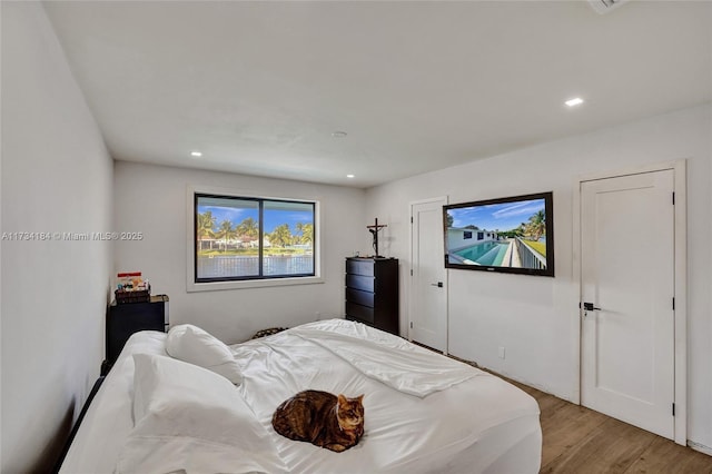 bedroom with light hardwood / wood-style floors