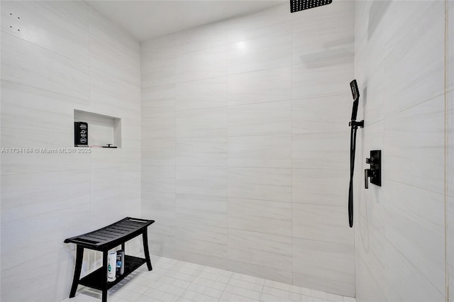 bathroom with a tile shower