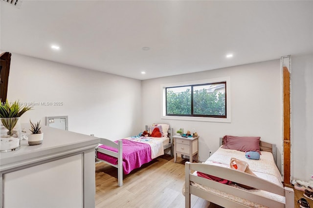 bedroom with light hardwood / wood-style flooring