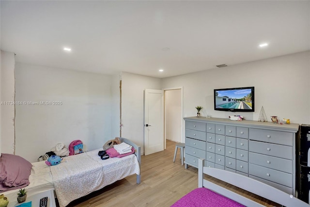 bedroom featuring light wood-type flooring