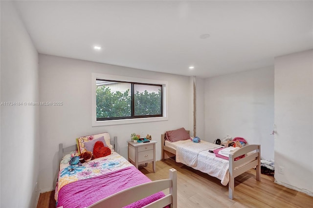 bedroom with light hardwood / wood-style floors