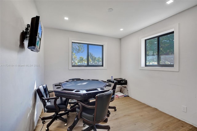 home office featuring a wealth of natural light and light hardwood / wood-style floors