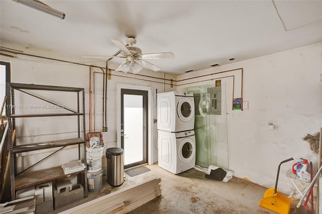 laundry room with ceiling fan and stacked washer / drying machine