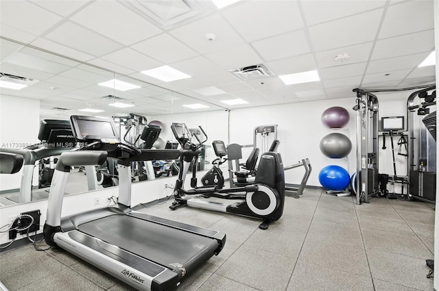 exercise room with a drop ceiling