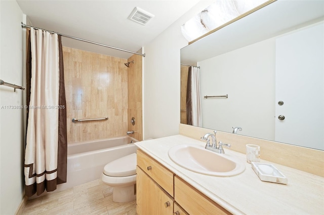 full bathroom featuring shower / bathtub combination with curtain, vanity, and toilet