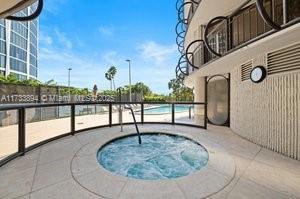 view of pool with a patio area and a community hot tub