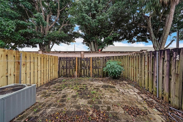 view of yard featuring cooling unit and a patio