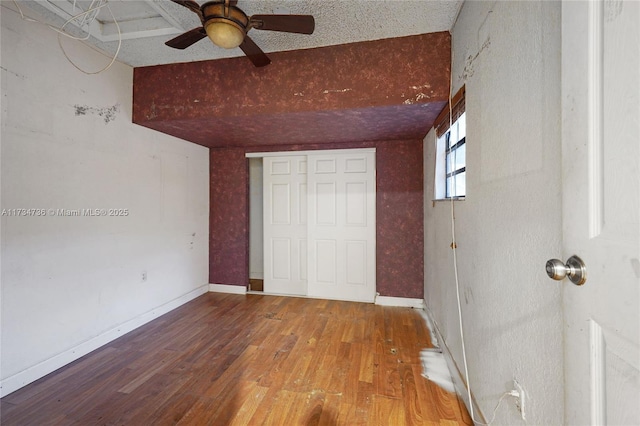 unfurnished bedroom featuring wood-type flooring and a closet