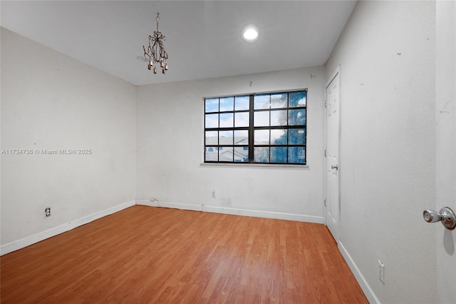 spare room featuring hardwood / wood-style flooring