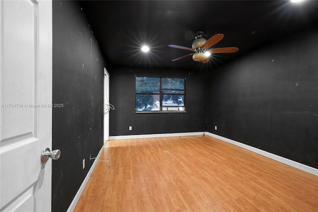 unfurnished room featuring ceiling fan and light hardwood / wood-style floors