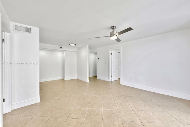 empty room featuring ceiling fan and light tile patterned floors