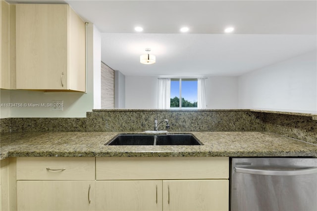 kitchen with light brown cabinets, stainless steel dishwasher, a sink, light stone countertops, and recessed lighting