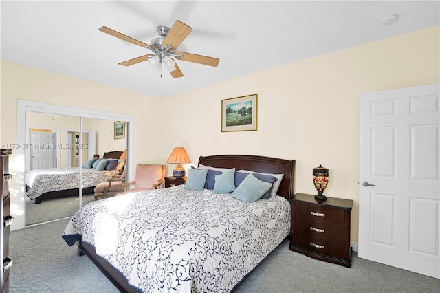 bedroom with a closet, ceiling fan, and carpet flooring