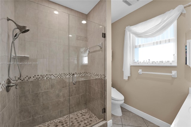 bathroom featuring an enclosed shower, tile patterned floors, and toilet