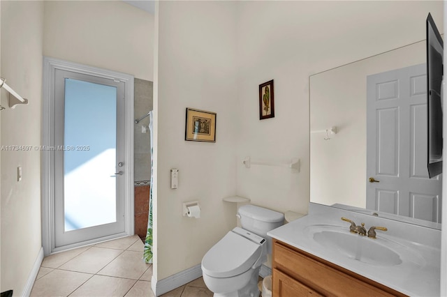 bathroom featuring vanity, tile patterned floors, toilet, and walk in shower