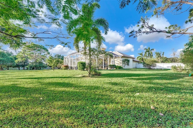 view of yard featuring a lanai