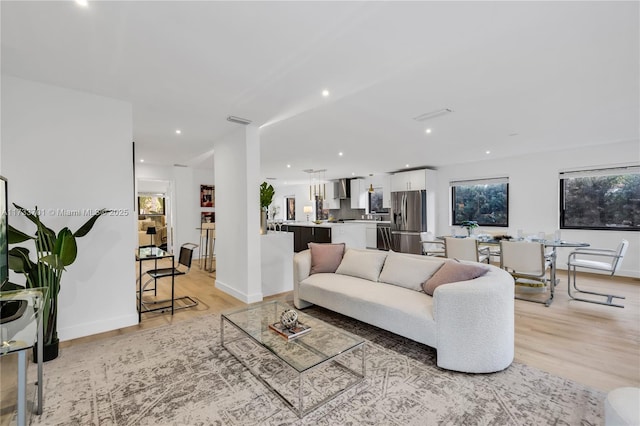 living room with light hardwood / wood-style flooring