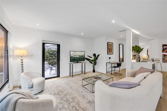 living room with light hardwood / wood-style floors