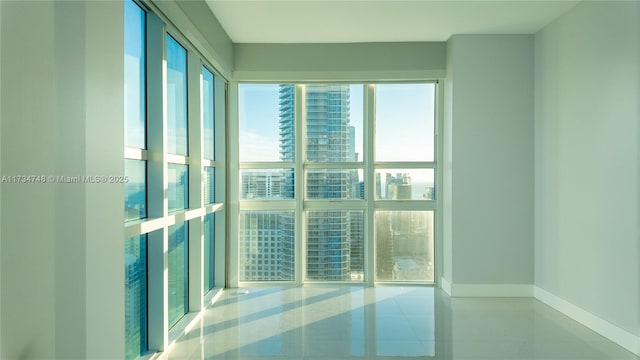 spare room featuring light tile patterned floors