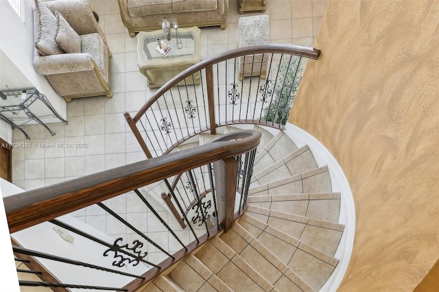 stairs with tile patterned flooring