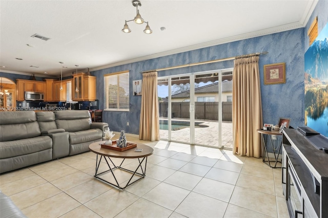 living room with crown molding and light tile patterned floors