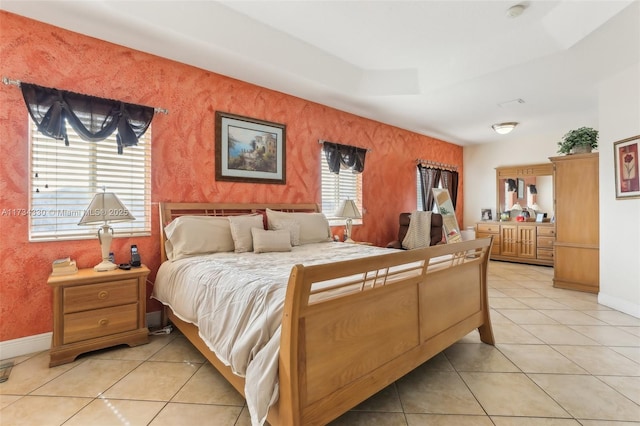 bedroom featuring light tile patterned floors