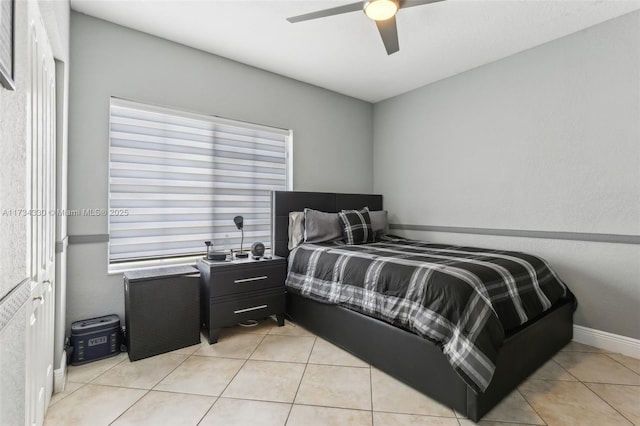 bedroom with light tile patterned floors and ceiling fan