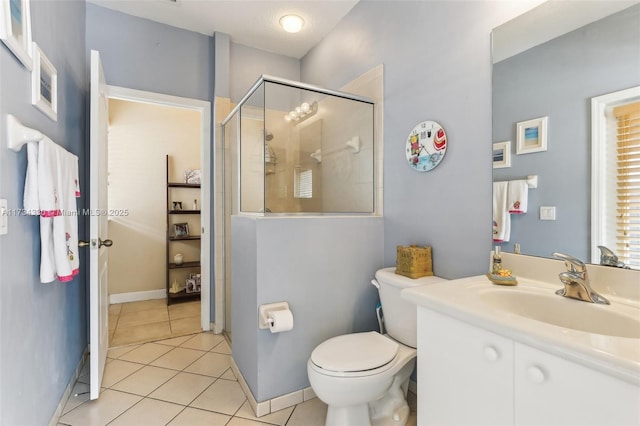 bathroom with walk in shower, tile patterned floors, toilet, and vanity