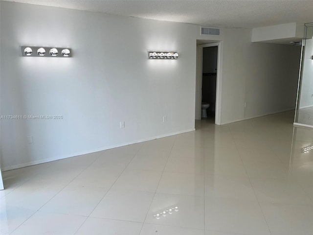 5838 Collins Ave Unit 3D, Miami Beach, FL 33140 - empty room with a textured ceiling