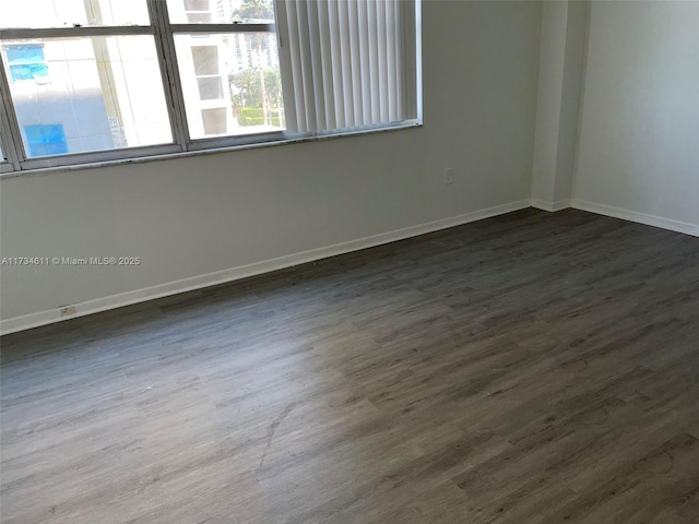5838 Collins Ave Unit 3D, Miami Beach, FL 33140 - spare room with dark wood finished floors