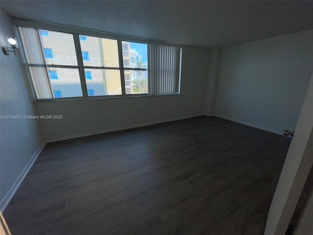 5838 Collins Ave Unit 3D, Miami Beach, FL 33140 - spare room featuring dark wood finished floors