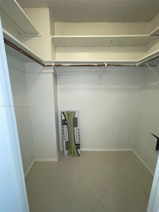 5838 Collins Ave Unit 3D, Miami Beach, FL 33140 - spacious closet with tile patterned flooring