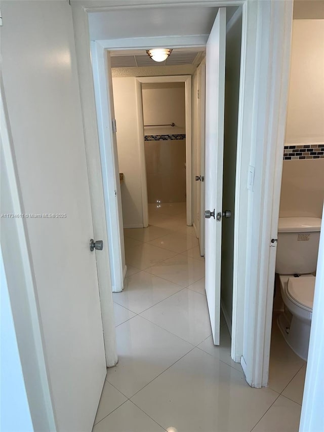 5838 Collins Ave Unit 3D, Miami Beach, FL 33140 - hallway featuring light tile patterned flooring