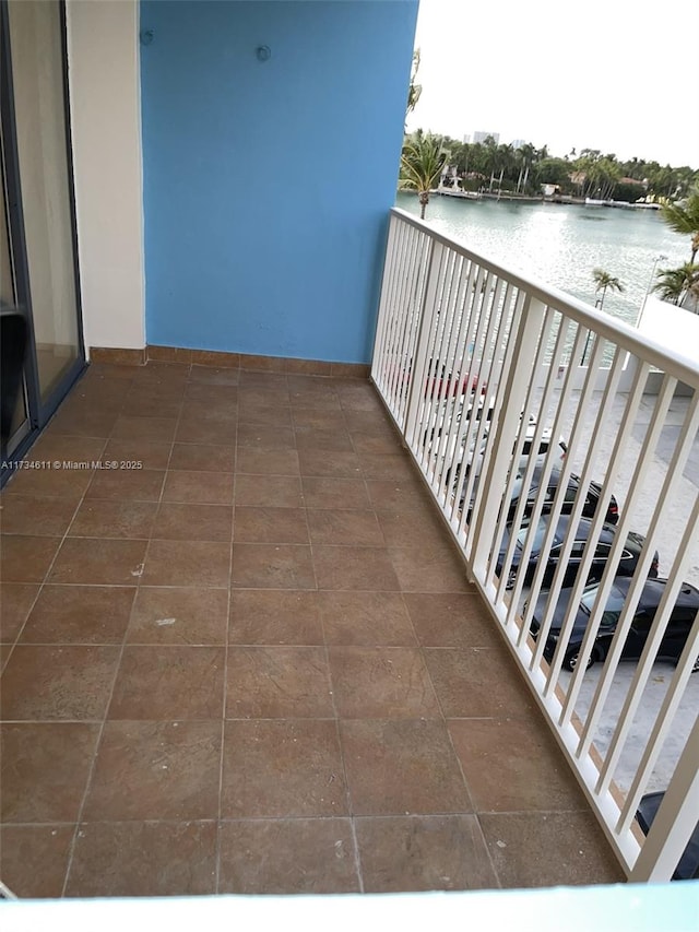 balcony featuring a water view