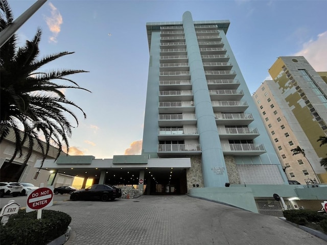 view of outdoor building at dusk