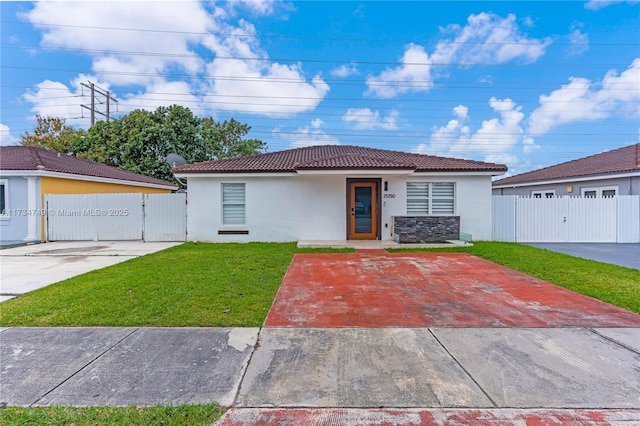 ranch-style house with a front lawn