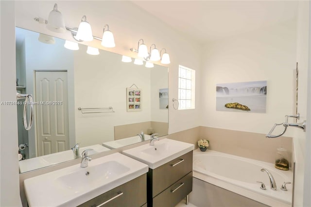 bathroom featuring vanity and a bathtub