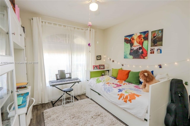 bedroom featuring dark wood-type flooring